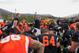 Former NFL coach Terry Shea (center) guides his players as they seek another chance at making it big.
