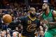 CLEVELAND, OH - DECEMBER 29: LeBron James #23 of the Cleveland Cavaliers passes around Jae Crowder #99 of the Boston Celtics during the first half at Quicken Loans Arena on December 29, 2016 in Cleveland, Ohio. NOTE TO USER: User expressly acknowledges a
