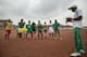 A coach instructs players at Anguissa.