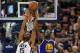 SALT LAKE CITY, UT - MAY 8: Derrick Favors #15 of the Utah Jazz and Draymond Green #23 of the Golden State Warriors try for the rebound in the second half of the Warriors 121-95 win in Game Four of the Western Conference Semifinals during the 2017 NBA Pla