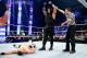 Roman Reigns celebrates a win over The Miz on SmackDown in 2015.