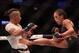 Jedrzejczyk lands a kick to Andrade's body.