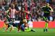 SUNDERLAND, ENGLAND - OCTOBER 29: Shkodran Mustafi challenges Jermain Defoe of Sunderland during the Premier League match between Sunderland and Arsenal at Stadium of Light on October 29, 2016 in Sunderland, England. (Photo by Stu Forster/Getty Images)