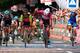 Colombian cyclist Fernando Gaviria (C) from QuickStep - Floors reacts as he crosses the finish line to win the 12th stage of the 100th Giro d'Italia, Tour of Italy cycling race from Forl?i to Reggio Emilia of 100th Giro d'Italia, Tour of Italy on May 18,