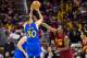 CLEVELAND, OH - DECEMBER 25: Stephen Curry #30 of the Golden State Warriors shoots over DeAndre Liggins #14 of the Cleveland Cavaliers during the second half at Quicken Loans Arena on December 25, 2016 in Cleveland, Ohio. The Cavaliers defeated the Warrio