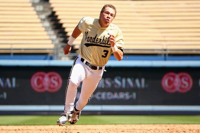 LOS ANGELES, CA - MARCH 08: Jeren Kendall #3 of Vanderbilt rounds second base on his way to third base on his triple during their Dodger Stadium College Baseball Classic against TCU at Dodger Stadium on March 8, 2015 in Los Angeles, California. TCU defea