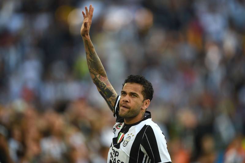 Juventus Defender from Brazil Dani Alves celebrates after winning the Italian Serie A football match Juventus vs Crotone and the 'Scudetto' at the Juventus Stadium in Turin on May 21, 2017. First-half goals from Mario Mandzukic and Paulo Dybala, and a lat