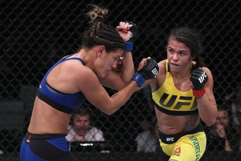 SAO PAULO, BRAZIL - NOVEMBER 19: Claudia Gadelha of Brazil punches Cortney Casey of the United States during their women's strawweight bout at the UFC Fight Night Bader v Minotouro at Ibirapuera Gymnasium on November 19, 2016 in Sao Paulo, Brazil. (Phot