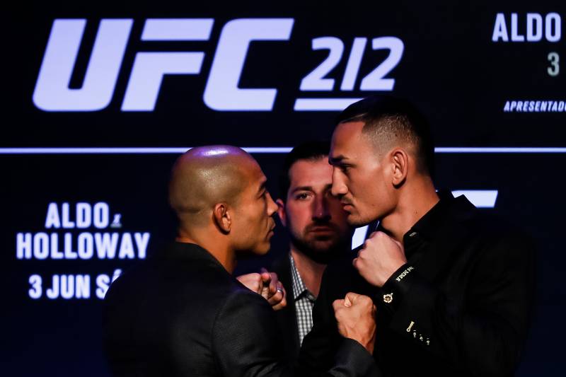 RIO DE JANEIRO, BRAZIL - APRIL 11: UFC Featherweight Champion Jose Aldo of Brazil (L) and challenger Max Holloway of the United States face off during the UFC 212 press conference at Morro da Urca on April 11, 2017 in Rio de Janeiro, Brazil. (Photo by Bu