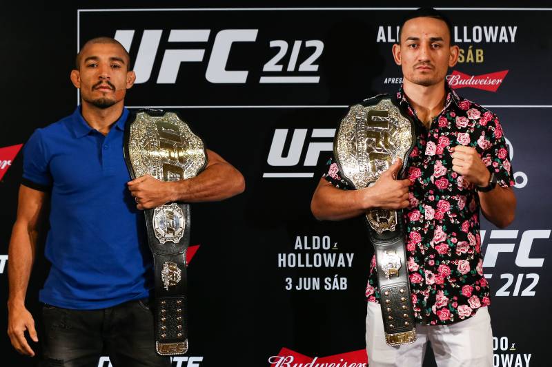 RIO DE JANEIRO, BRAZIL - JUNE 01: UFC featherweight fighters Jose Aldo (L) of Brazil and Max Holloway of the United States pose for photographers during Ultimate Media Day at Windsor Hotel on June 01, 2017 in Rio de Janeiro, Brazil. (Photo by Buda Mendes/