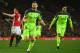 MANCHESTER, ENGLAND - JANUARY 15: James Milner of Liverpool (C) celebrates as he scores their first goal from a penalty during the Premier League match between Manchester United and Liverpool at Old Trafford on January 15, 2017 in Manchester, England. (
