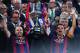 BARCELONA, SPAIN - MAY 30: FC Barcelona players Andres Iniesta (L) and Xavi Hernandez of FC Barcelona celebrate with the trophy after winning the Copa del Rey Final match between FC Barcelona and Athletic Club at Camp Nou on May 30, 2015 in Barcelona, Sp