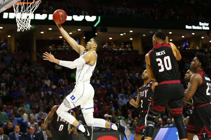 Mar 17, 2017; Greenville, SC, USA; Duke Blue Devils forward Jayson Tatum (0) shoots the ball against Troy Trojans forward Alex Hicks (30) during the second half in the first round of the 2017 NCAA Tournament at Bon Secours Wellness Arena. Mandatory Credit