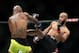 Johnson lands a kick to Reis.