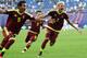 Venezuela's forward Samuel Sosa (L), midfielder Yeferson Soteldo (C) and forward Adalberto Penaranda Maestre celebrate a goal during the U-20 World Cup semi-final football match between Uruguay and Venezuela in Daejeon on June 8, 2017. / AFP PHOTO / Yeli