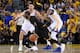 Jun 4, 2017; Oakland, CA, USA; Cleveland Cavaliers guard Kyrie Irving (2) dribbles the ball against Golden State Warriors guard Klay Thompson (11) and forward Kevin Durant (35) during the second half in game two of the 2017 NBA Finals at Oracle Arena. Man