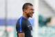 France's forward Kylian Mbappe smiles during a training session at the Stade de France stadium in Saint-Denis, north of Paris, on June 12, 2017 on the eve of the friendly football match against England. / AFP PHOTO / FRANCK FIFE (Photo credit shou