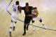 OAKLAND, CA - JUNE 04: LeBron James #23 of the Cleveland Cavaliers attempts to run past Kevin Durant #35 and Stephen Curry #30 of the Golden State Warriors during the second half of Game 2 of the 2017 NBA Finals at ORACLE Arena on June 4, 2017 in Oakland,