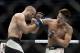 Dong Hyun Kim (right) hits Tarec Saffiedine.