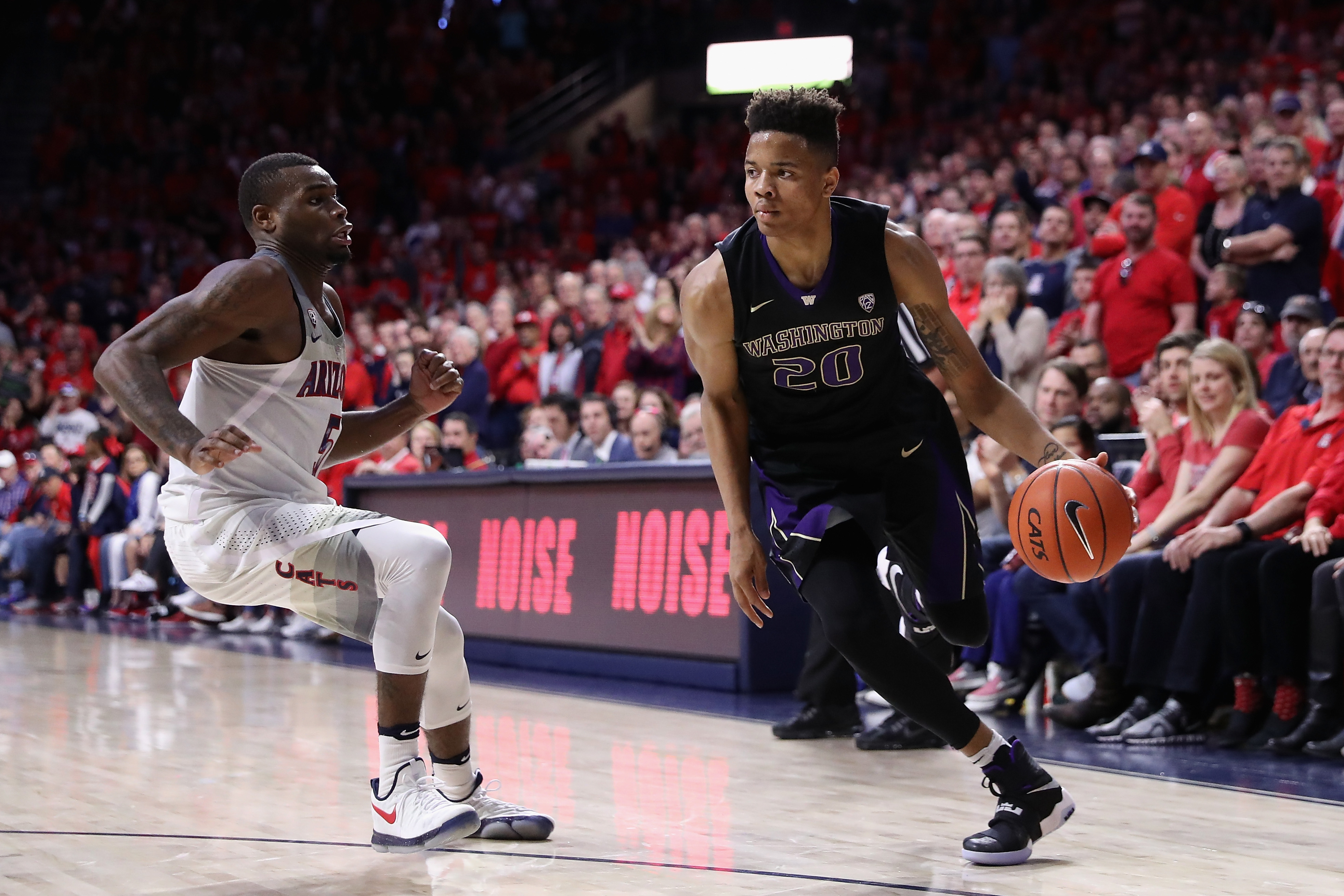 TUCSON, AZ - JANUARY 29: Markelle Fultz #20 of the Washington Huskies handles the ball against Kadeem Allen #5 of the Arizona Wildcats during the second half of the college basketball game at McKale Center on January 29, 2017 in Tucson, Arizona. The Wild