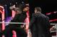 Roman Reigns hits Vince McMahon with a Superman Punch.