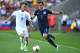 Slovakia's midfielder Albert Rusnak (L) and England's defender Ben Chilwell vie for the ball during the UEFA U-21 European Championship Group A football match Slovakia v England in Kielce, Poland on June 19, 2017. / AFP PHOTO / PIOTR NOWAK (Photo c