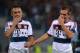 Bayern Munich's defender Philipp Lahm (R) and Bayern Munich's Brazilian defender Rafinha celebrate after winning 1-7 the Champions League group stage football match AS Roma vs Bayern Munich on October 21, 2014 at the Olympic stadium in Rome. AFP PHOT