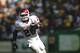 EUGENE, OR - SEPTEMBER 16: Adrian Peterson #28 of the Oklahoma Sooners scores a touchdown against the Oregon Ducks on September 16, 2006 at Autzen Stadium in Eugene, Oregon. (Photo by Jonathan Ferrey/Getty Images)