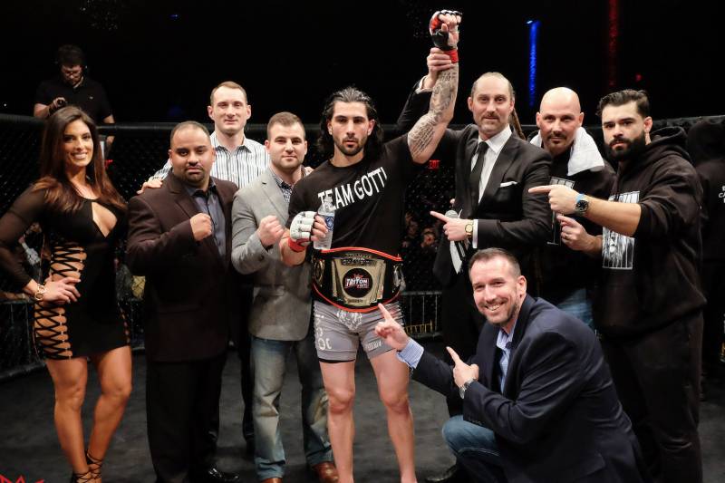 Gotti celebrates the first of what he hopes to be several MMA championships.