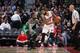 AUBURN HILLS, MI - DECEMBER 26: Marcus Morris #13 of the Detroit Pistons handles the ball against Jae Crowder #99 of the Boston Celtics on December 26, 2015 at The Palace of Auburn Hills in Auburn Hills, Michigan. NOTE TO USER: User expressly acknowledge