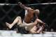 Nov 12, 2016; New York, NY, USA; Yoel Romero (blue gloves) takes down and defeats Chris Weidman (red gloves) during UFC 205 at Madison Square Garden. Mandatory Credit: Adam Hunger-USA TODAY Sports