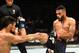 LAS VEGAS, NV - JULY 08: (R-L) Rob Font kicks Douglas Silva de Andrade of Brazil in their bantamweight bout during the UFC 213 event at T-Mobile Arena on July 8, 2017 in Las Vegas, Nevada. (Photo by Josh Hedges/Zuffa LLC/Zuffa LLC via Getty Images)