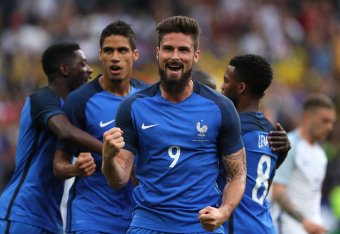 PARIS, FRANCE - JUNE 13:   Olivier Giroud of France celebrates after Samuel Umtiti of France scored a goal to make the score 1-1 during the International Friendly match between France and England at Stade de France on June 13, 2017 in Paris, France.  (Pho