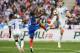 England's midfielder Eric Dier (R) and England's midfielder Raheem Sterling (L) fight for the ball with France's defender N'golo Kante (C) during the international friendly football match between France and England at The Stade de France Stadium in Saint-