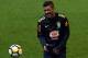 Brazil's player Paulinho laughs during a raining session with teammates in Melbourne on June 8, 2017, ahead of their football match against Brazil on June 9. / AFP PHOTO / SAEED KHAN / -- IMAGE RESTRICTED TO EDITORIAL USE - STRICTLY NO COMMERCIAL USE --