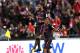 Arsenal player Alexandre Lacazette (C) celebrates scoring for his first goal for Arsenal in his first match during their football friendly against Sydney FC played in Sydney on July 13, 2017. / AFP PHOTO / WILLIAM WEST / -- IMAGE RESTRICTED TO EDITORIAL U