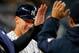 NEW YORK, NY - APRIL 19: Aaron Judge #99 of the New York Yankees is congratulated by teammates after scoring on a single by Austin Romine #27 in the second inning against the Chicago White Sox during a game at Yankee Stadium on April 19, 2017 in New York