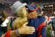 Former Ole Miss head coach Hugh Freeze embraces his wife after a game against Alabama.