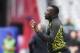 Jamaica's head coach Theodore Whitmore talks to his team during their quarterfinal match of the 2017 CONCACAF Gold Cup against Canda at the University of Phoenix Stadium on July 20, 2017 in Glendale, Arizona. Jamaica won 2-1. / AFP PHOTO / Robyn Beck