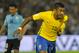 Brazil's midfielder Paulinho celebrates his second goal during their 2018 FIFA World Cup qualifier football match against Uruguay at the Centenario stadium in Montevideo, on March 23, 2017. / AFP PHOTO / DANTE FERNANDEZ (Photo credit should read DA