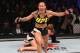 CURITIBA, BRAZIL - MAY 14: (L-R) Cristiane 'Cyborg' Justino of Brazil celebrates after defeating Leslie Smith in their women's catchweight bout during the UFC 198 event at Arena da Baixada stadium on May 14, 2016 in Curitiba, Parana, Brazil. (Photo by J