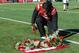 LINCOLN, NE - NOVEMBER 19: Quarterback Tommy Armstrong Jr. #4 of the Nebraska Cornhuskers places a rose in memory of deceased player Sam Foltz before the game against the Maryland Terrapins at Memorial Stadium on November 19, 2016 in Lincoln, Nebraska. (P