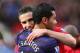 MANCHESTER, ENGLAND - NOVEMBER 03: Robin van Persie of Manchester United embraces Andre Santos of Arsenal prior to the Barclays Premier League match between Manchester United and Arsenal at Old Trafford on November 3, 2012 in Manchester, England. (Photo