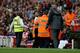 Security spared Wenger the abuse of an unhappy fan.