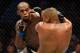 Jones lands a left hand against Cormier.