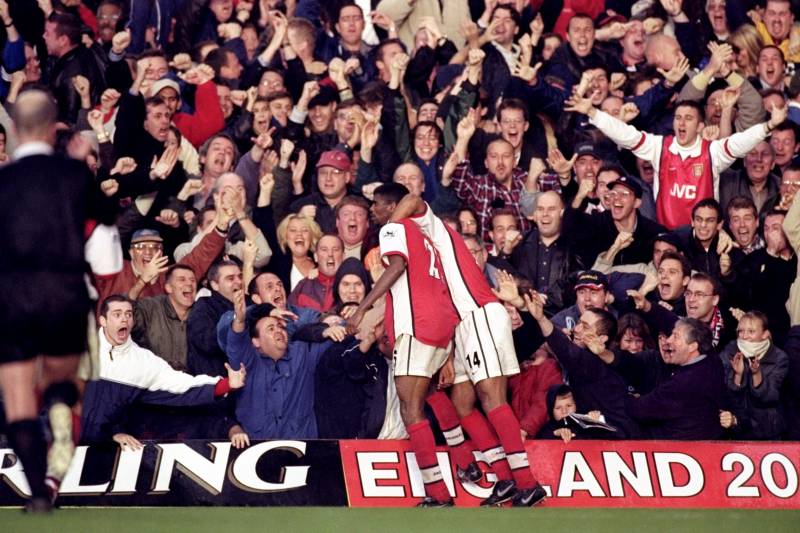 23 Oct 1999:  Nwankwo Kanu and Thierry Henry (#14) of Arsenal celebrate Kanu's 90th minute winner during the FA Carling Premier League match against Chelsea played at Stamford Bridge, London. The game finished in 3-2 win for Arsenal.  \ Mandatory Credit:G