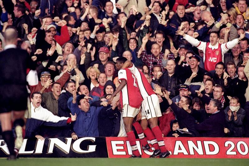 23 Oct 1999: Nwankwo Kanu and Thierry Henry (#14) of Arsenal celebrate Kanu's 90th minute winner during the FA Carling Premier League match against Chelsea played at Stamford Bridge, London. The game finished in 3-2 win for Arsenal. \ Mandatory Credit:G