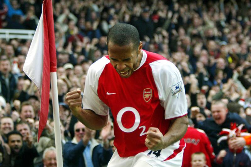LONDON, UNITED KINGDOM: Arsenal's French forward Thierry Henry celebrates his first goal setting up hat trick against Liverpool during their premier league clash at Highbury in London, 09 April 2004. Arsenal won the match 4-2. AFP PHOTO / ODD ANDE