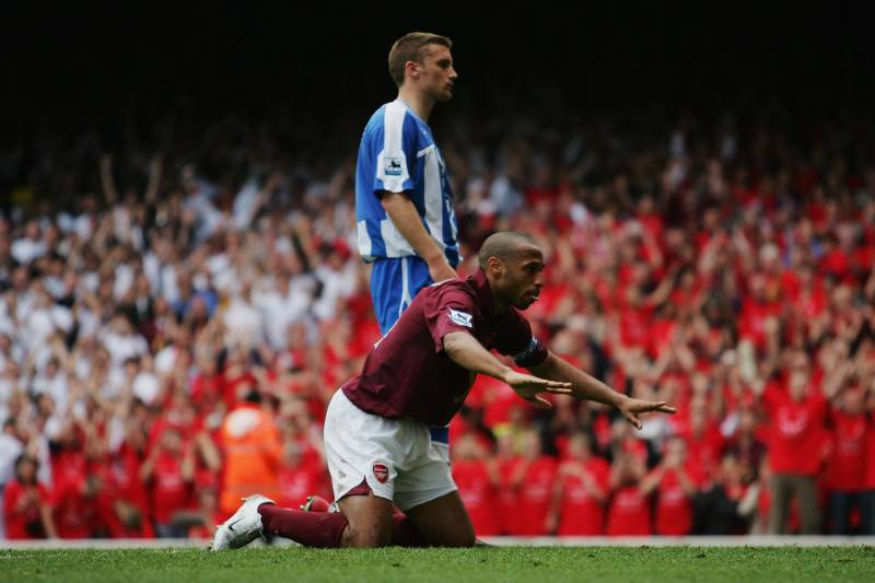 LONDON - MAY 07:  Thierry Henry of Arsenal celebrates scoring his teams fourth goal by bowing to the North Bank fans during the Barclays Premiership match between Arsenal and Wigan Athletic at Highbury on May 7, 2006 in London, England.  The match was the