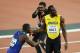 LONDON, ENGLAND - AUGUST 05: Usain Bolt of Jamaica hugs Justin Gatlin of the United States following Gatlin's win in the Men's 100 metres final in 9.92 seconds during day two of the 16th IAAF World Athletics Championships London 2017 at The London Stadiu